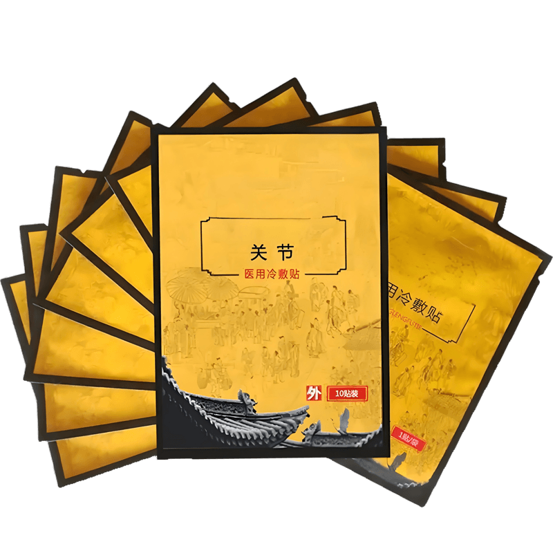 Gold and black printed cold compress patch sachets arranged in a fan